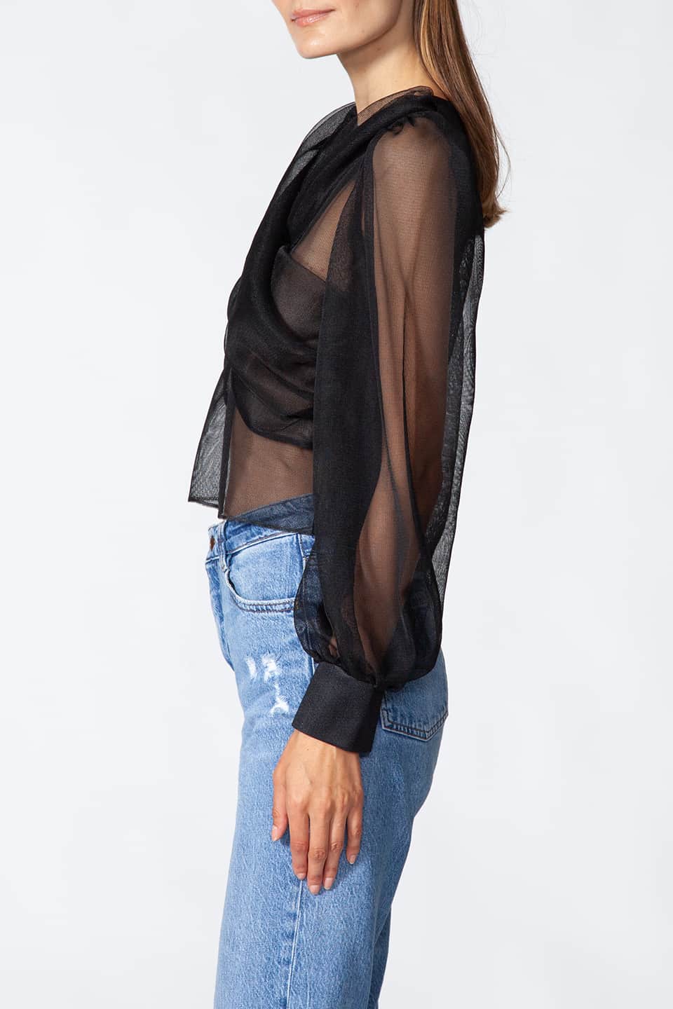 Long sleeve top in black color with puffy sleeves, from Kukhareva London Fashion Stylist is wore by model posing on the left side