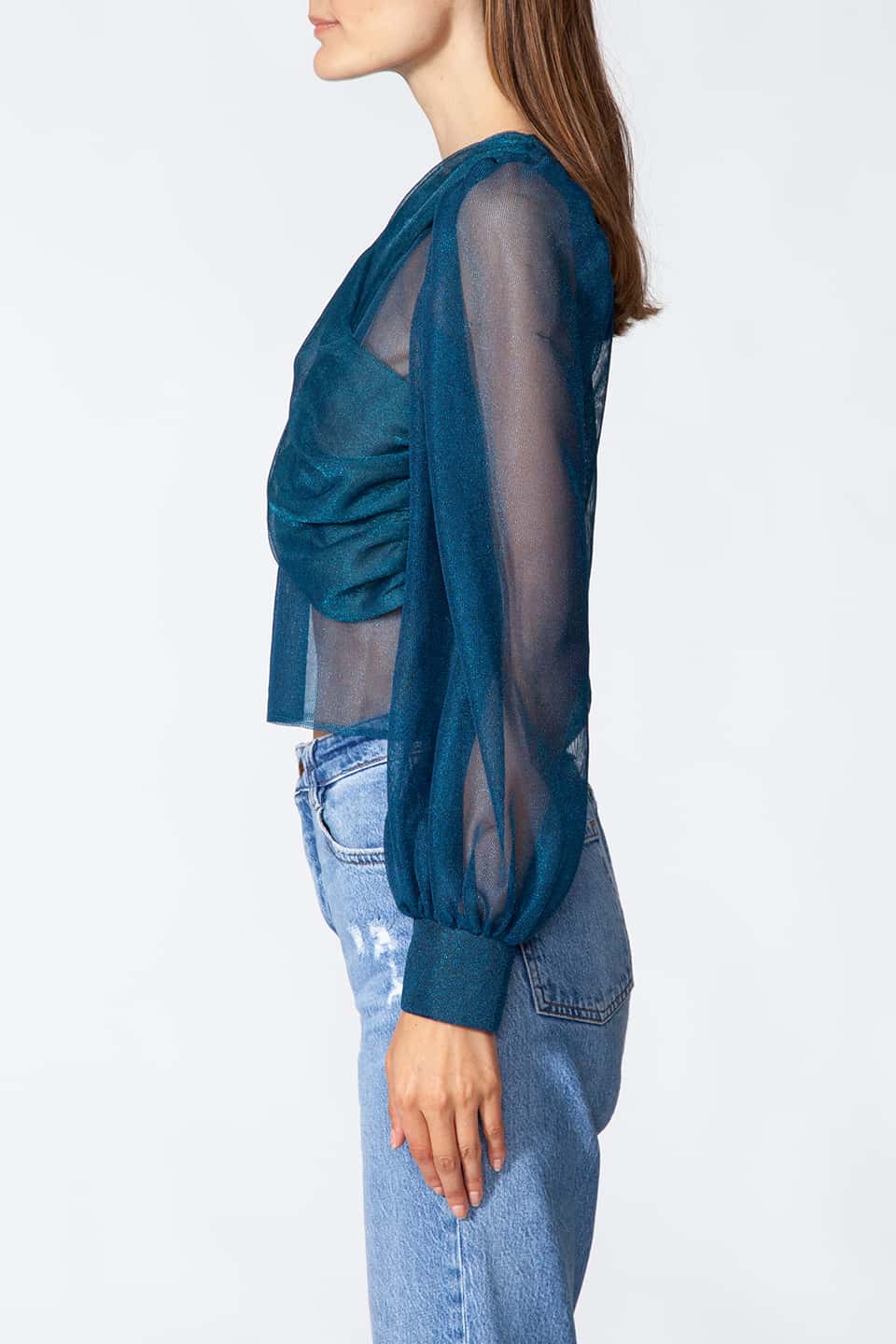 Long sleeve top in Teal color with puffy sleeves, from Kukhareva London Fashion Stylist is wore by model posing on a side