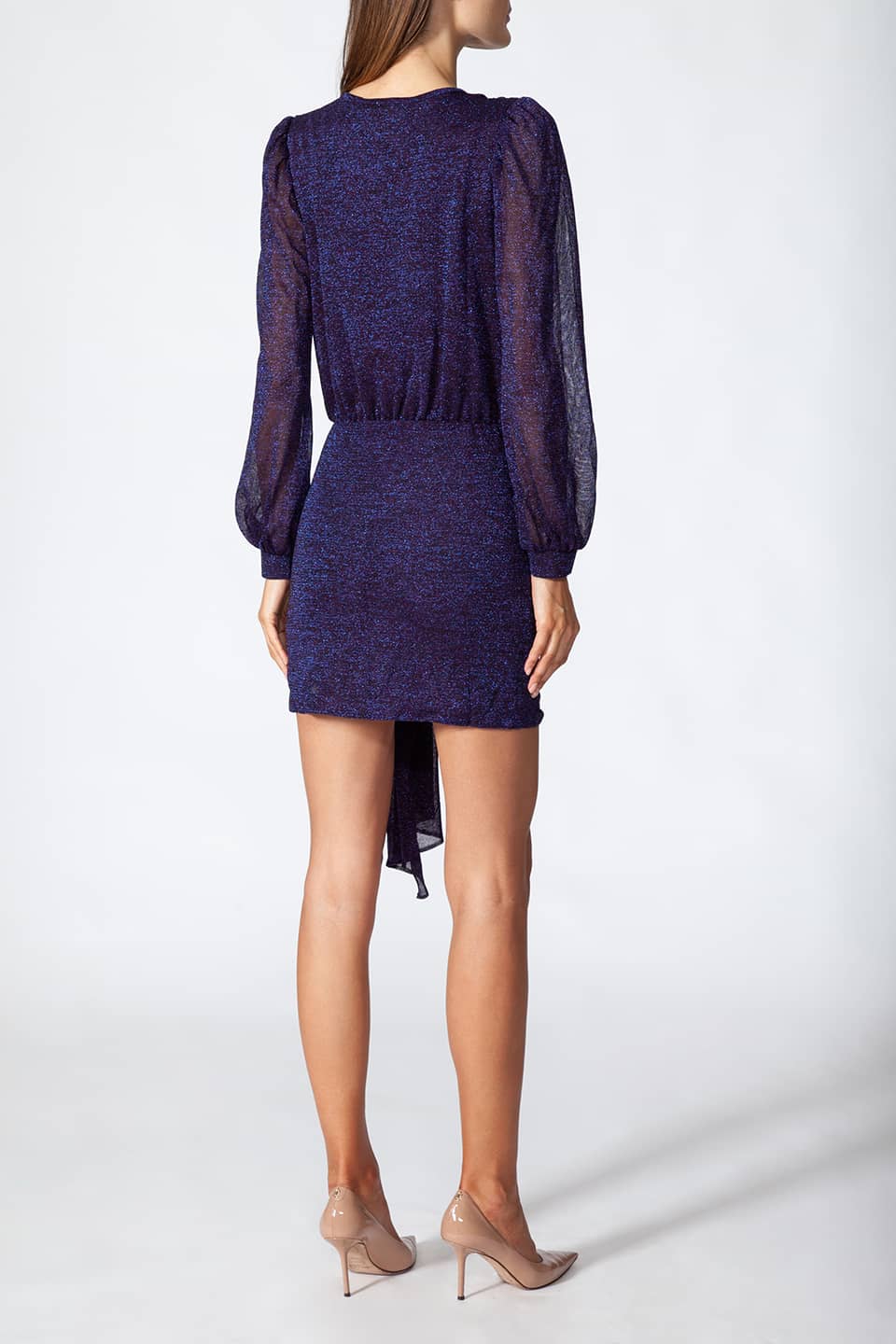 Model in pose from behind, wearing fashion designer Kukhareva London mini dress with long sleeve in purple color and shimmering material.