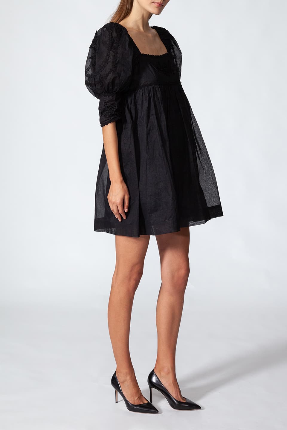 Fashion designer short dress in black color with floral embroidery, full view