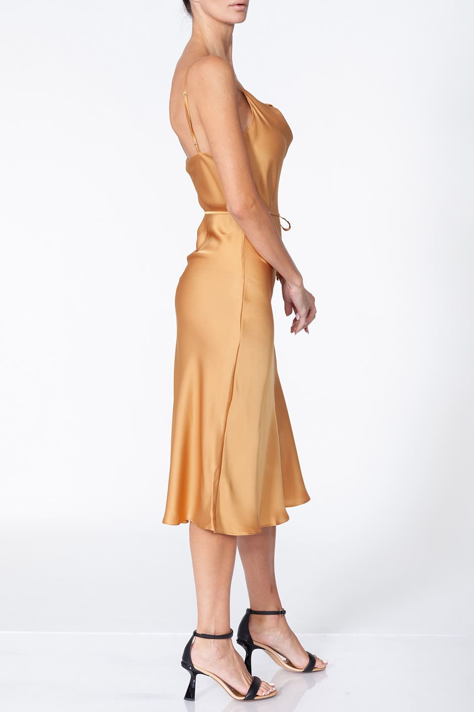 Fashion Stylist Anze's gold midi dress full-body left side view with model in pose