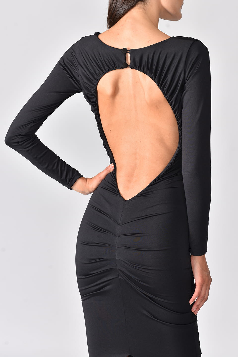 backless dress in black color from fashion designer