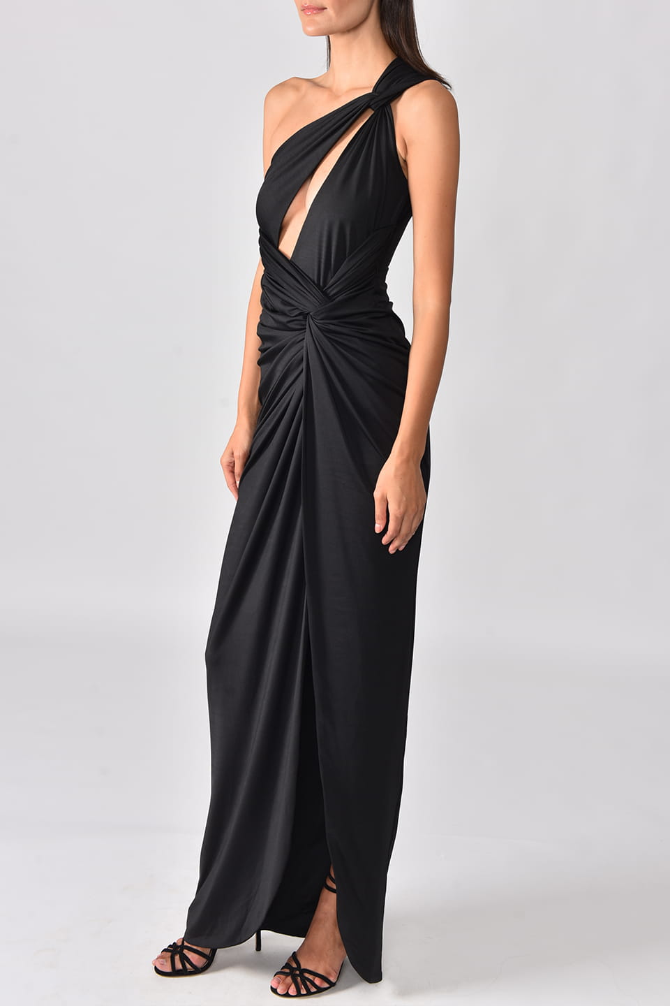 Thumbnail for Product gallery 3, Model wearing black one shoulder dress with long side slit from Hamel fashion designer, posing on left side