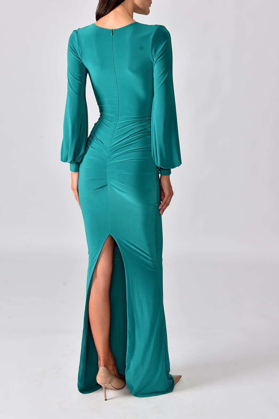Thumbnail for Product gallery 2, Model wearing emerald green dress with long sleeves from Hamel fashion stylist, posing from behind