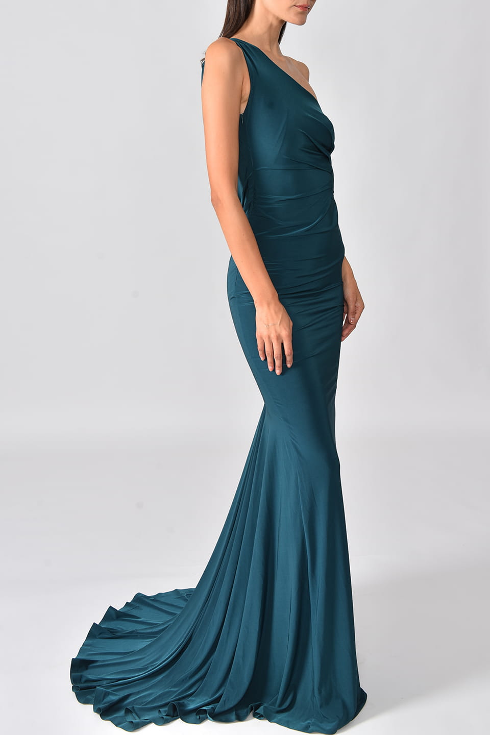 Model wears Special occasion Maxi dress in Petrol Blue color from Hamel fashion stylist, posing on a side