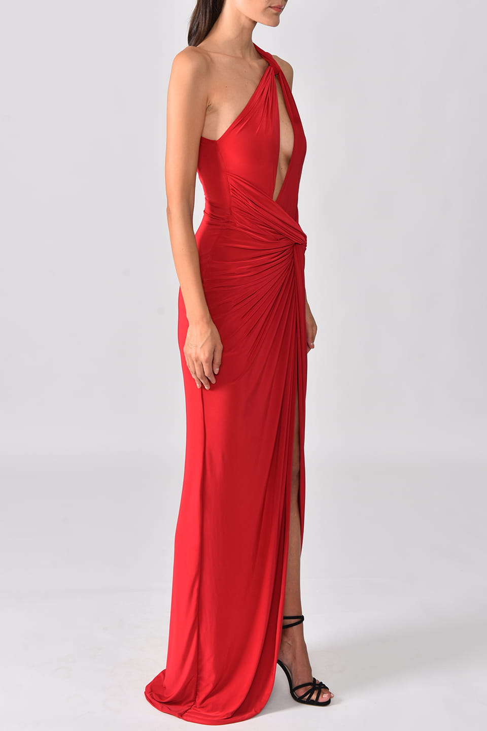 Model wearing one shoulder red maxi dress from stylist Hamel, posing on right side