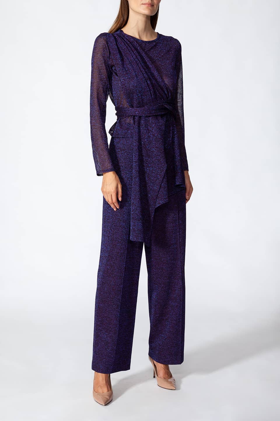 Model in pose wearing Stylist Kukhareva London trousers, with wide leg pants with pressed creases and a hight-rise waist in Purple Color