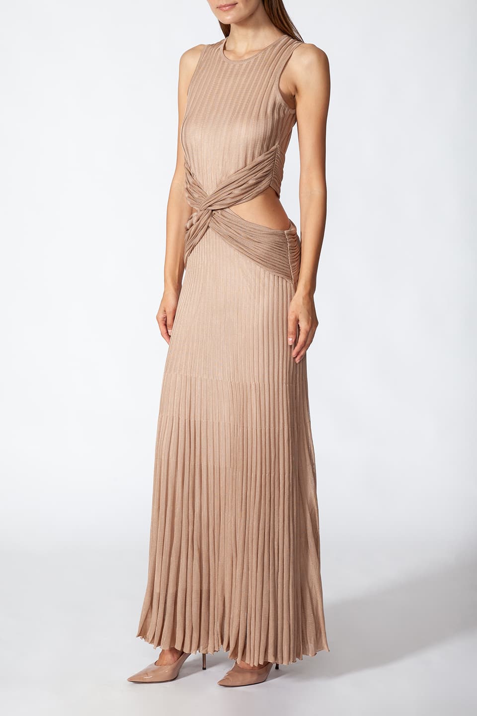 Model in pose wearing Fashion Stylist Kukhareva London's elegant gold dress. Long evening dress crafted from gold viscose blend featuring round neckline.