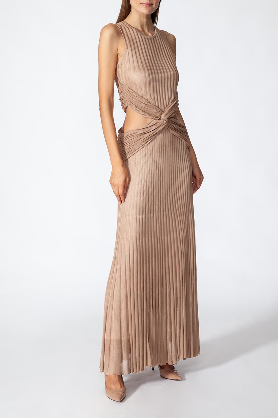 Model in pose for front - side view, wearing Fashion Stylist Kukhareva London's elegant gold dress. Long evening dress crafted from gold viscose blend featuring round neckline.