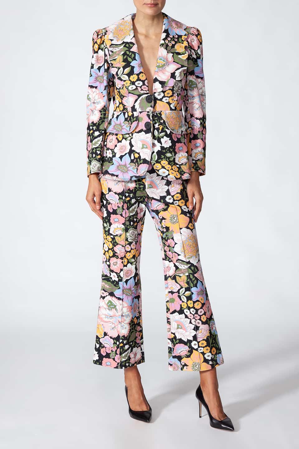 Model showing Manoush European stylist's flare trousers in corduroy with floral print. Front full body view, with jacket