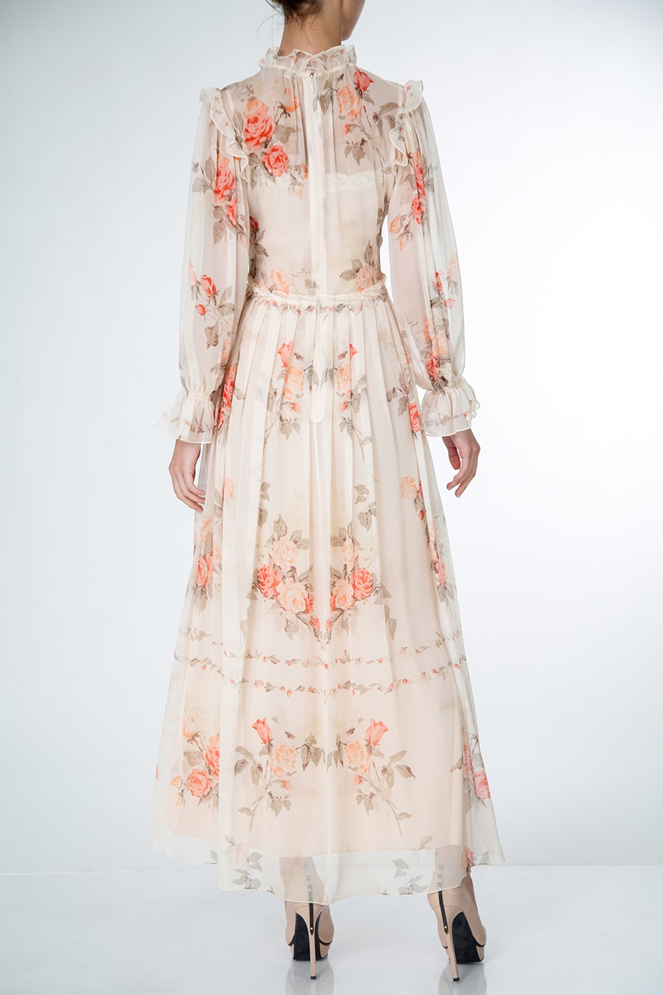 Midi dress from fashion designer in peach pink color with floral print, product view from behind