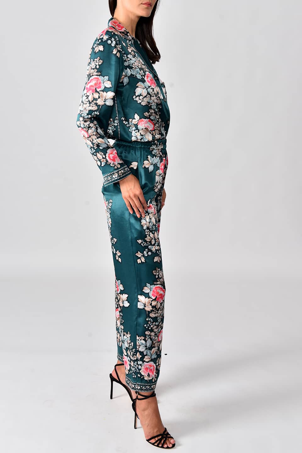 Thumbnail for Product gallery 1, Model wearing silk satin pyjama trousers in a forest green print from stylist Vilshenko, in pose