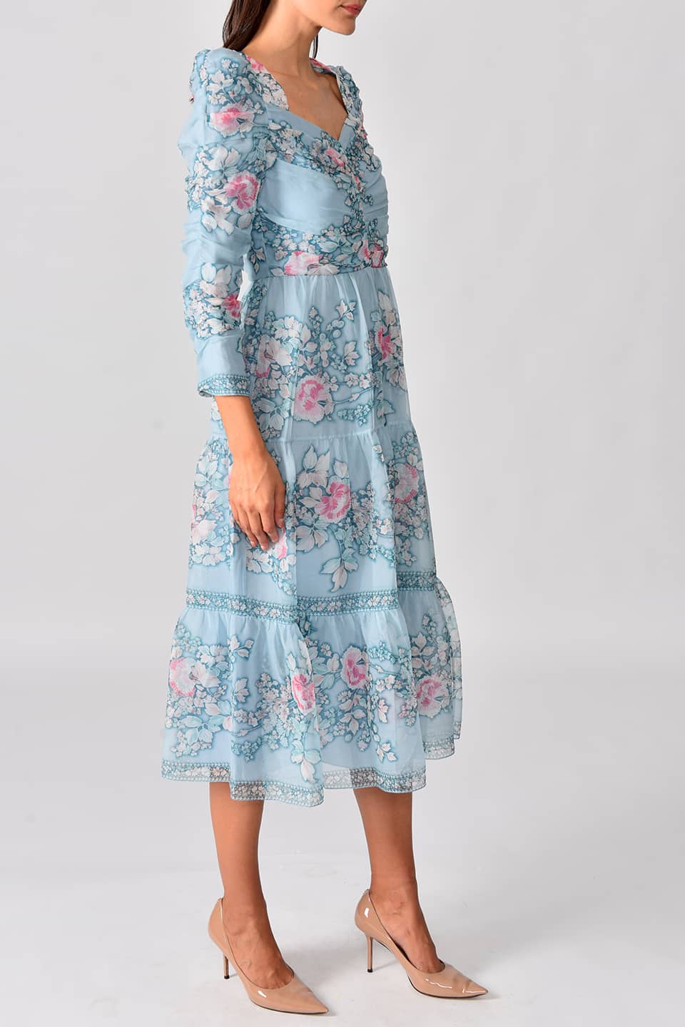 Thumbnail for Product gallery 3, Model wearing floral print silk chiffon tiered long dress in a pale blue color from stylist Vilshenho, posing on right side