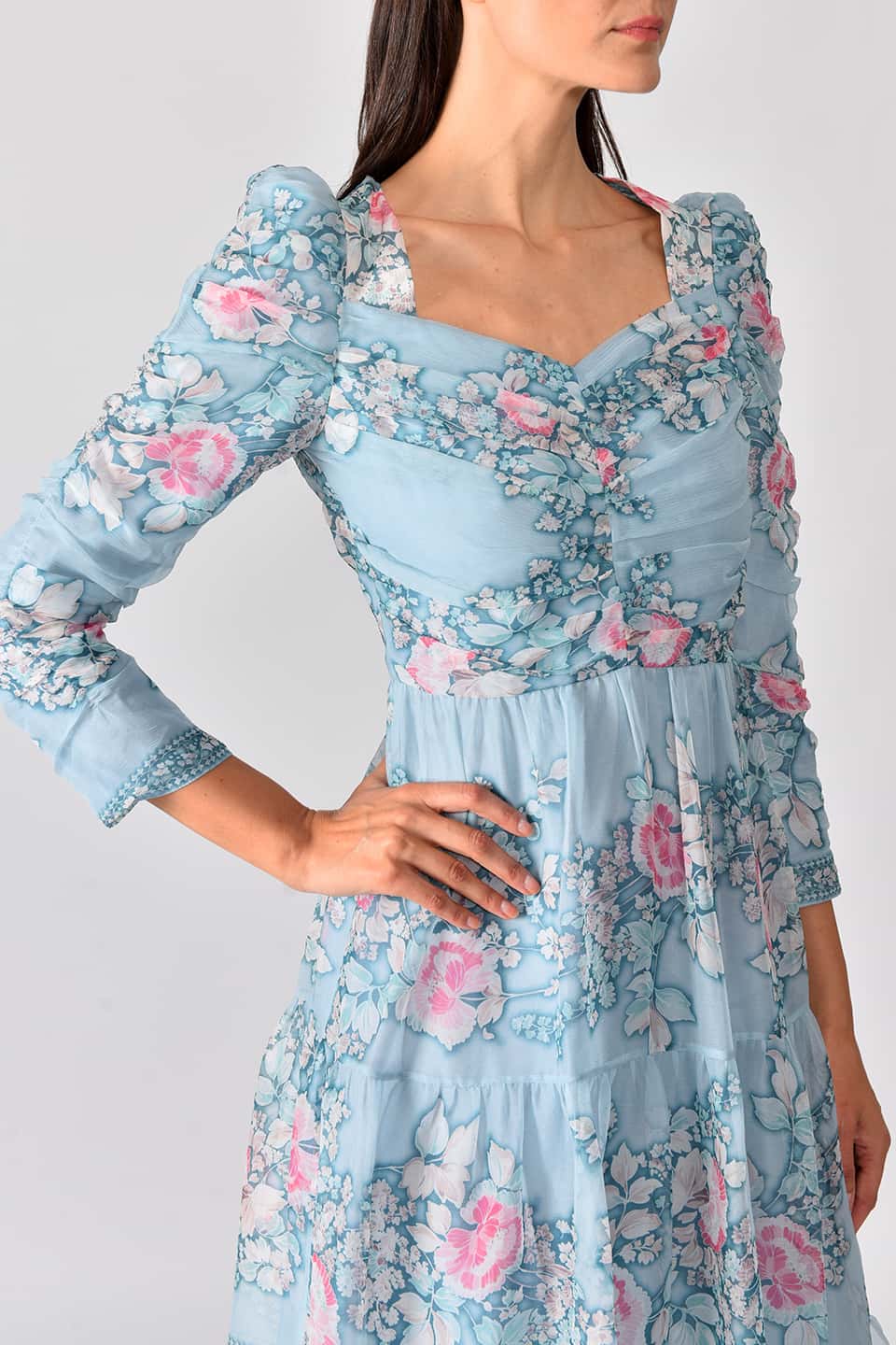 Thumbnail for Product gallery 7, Model wearing floral print silk chiffon tiered long dress in a pale blue color from stylist Vilshenho, in pose